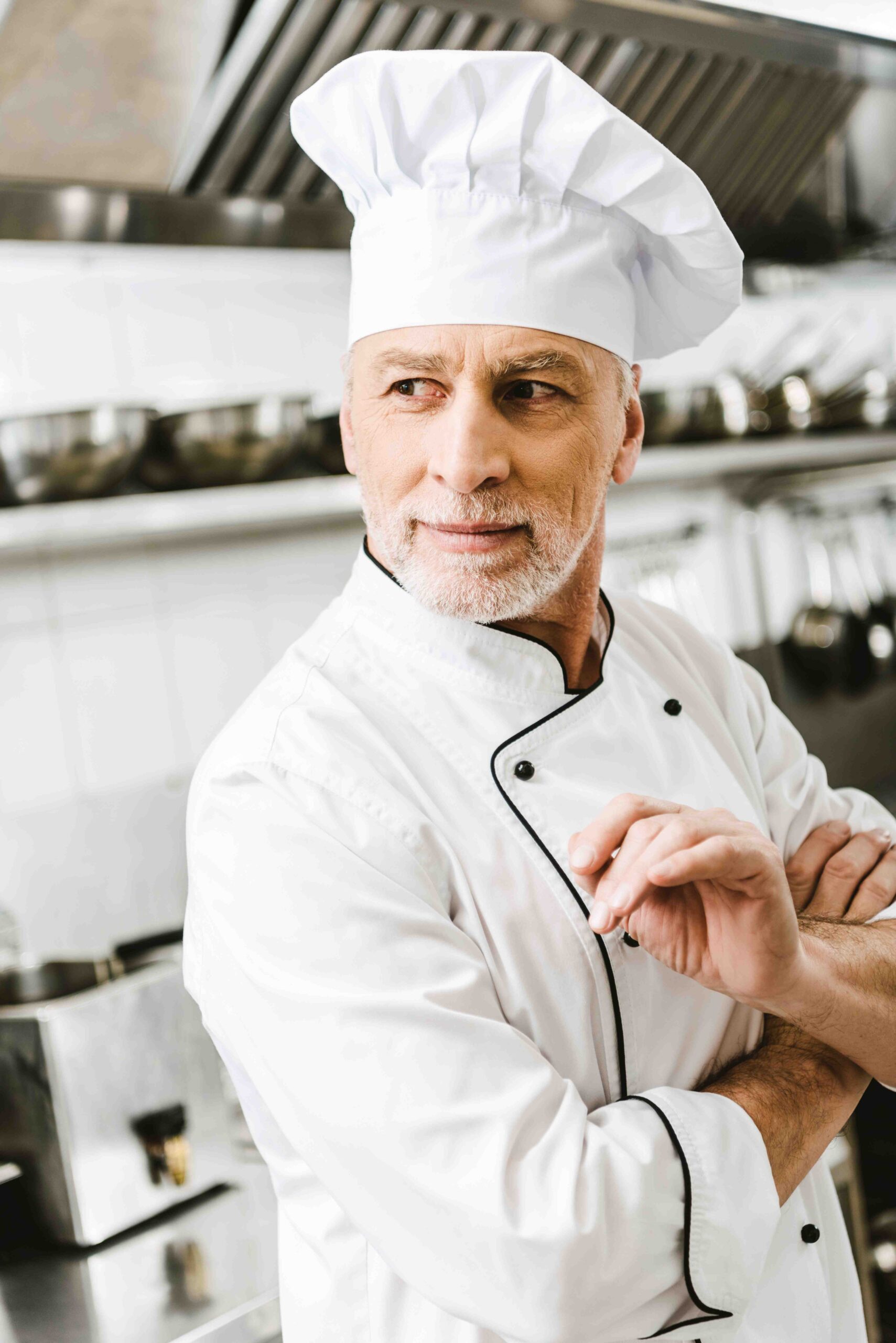 handsome male chef in uniform and cap looking away 2022 12 08 05 04 25 utc scaled