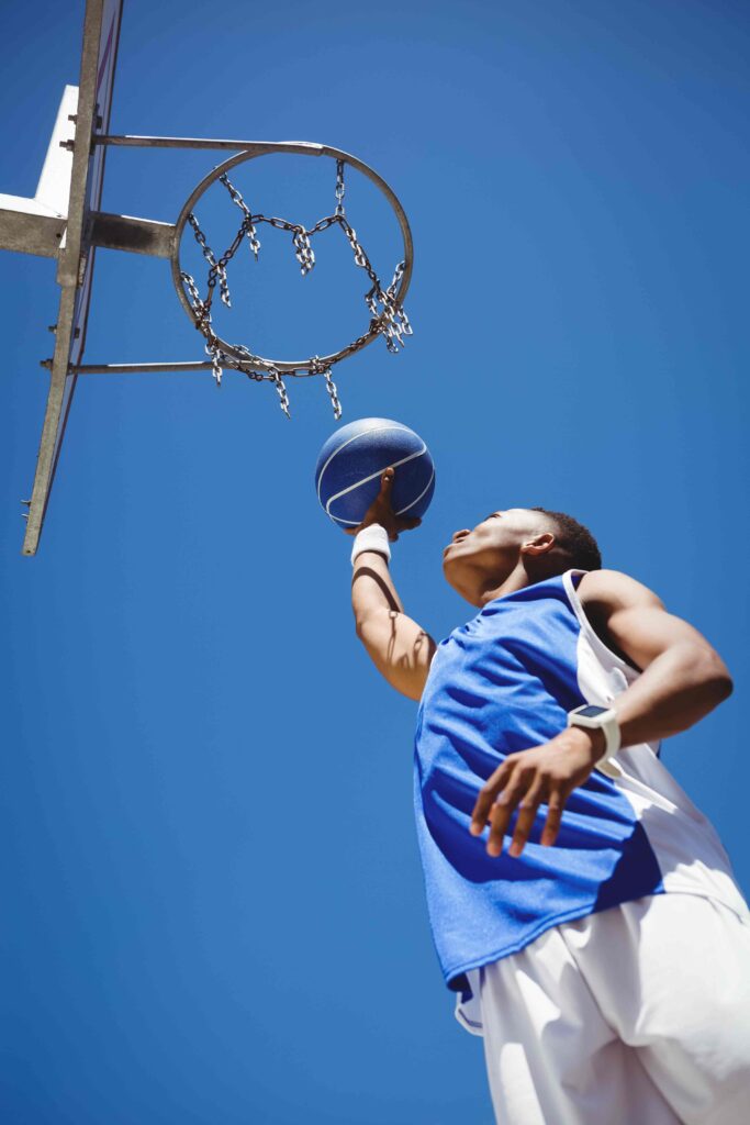 low angle view of teenager playing basketball 2021 08 28 16 46 02 utc